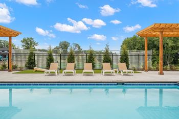 Poolside sundeck with chaise lounges